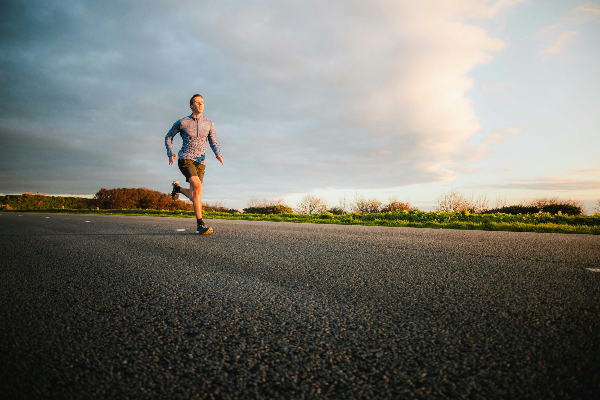 A picture of a man running on a sunny day